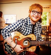 Ed Sheeran with Buddy Holly Guitar and Buddy Holly Tattoo