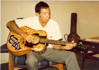 Larry Holly with Buddy Holly's Acoustic Guitar