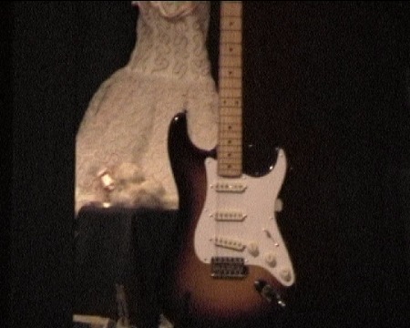 Buddy's_guitar_and_Maria_Elena's_Wedding_Dress.jpg